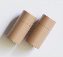 Brown Paper tube package mockups isolated on white background. Blank craft carton circular realistic tube texture. Cylindrical container with cap for product branding photo