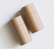 Brown Paper tube package mockups isolated on white background. Blank craft carton circular realistic tube texture. Cylindrical container with cap for product branding photo