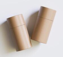 Brown Paper tube package mockups isolated on white background. Blank craft carton circular realistic tube texture. Cylindrical container with cap for product branding photo