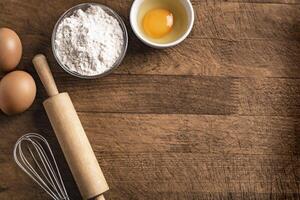 Baking background with flour, eggs, rolling pin. photo