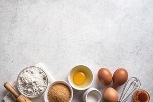 Baking background with flour, eggs, rolling pin. photo