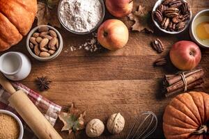 Autumn baking background with pumpkins, apples and nuts photo