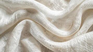 Soft, white fabric with delicate, linear texture patterns. photo