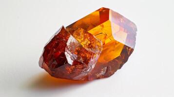 Closeup of a Polished Sphalerite Gemstone with Vivid Orange and Red Hues on White Background photo