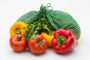 Fresh, colorful vegetables in a net bag. photo