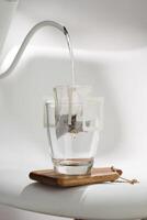A Drip Bag methodically filters water through Coffee grounds, exemplifying precision in brewing techniques. photo