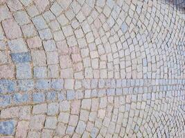 Abstract background. Old cobblestone pavement close-up. photo
