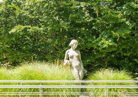 Podebrady- Czech- 27 July 2024. Leda with swan and park promenade, spa town photo