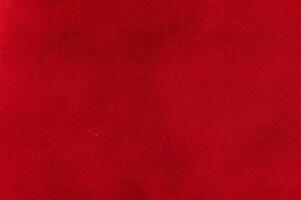 Red suede background. A thin focal part of the red background photo