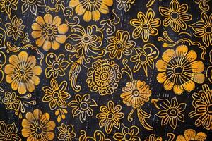 A batik texture background features intricate, hand-dyed patterns with a distinctive wax-resist design photo