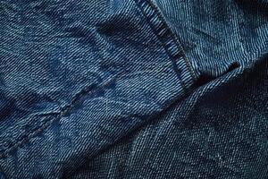 A denim texture background features a classic, rugged fabric with a distinctive twill weave pattern photo