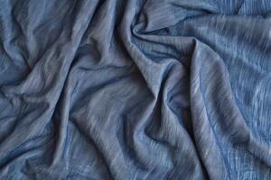 A chambray texture background features a soft, woven fabric look with a subtle, denim-like appearance photo