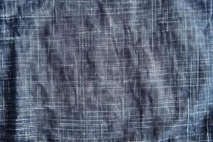 A chambray texture background features a soft, subtle weave with a classic, casual appeal photo