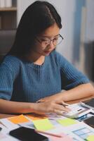 The designer team is designing the uxui system to make the uxui system work well on new phones and support system updates. Website development concept UI UX front end designer photo
