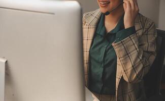Call center, computer and business with woman in office for customer service, technical support and advice. Technology, contact us and communication with employee operator in help desk agency photo