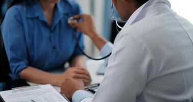Doctor using a stethoscope checking patient with examining, presenting results symptom and recommend treatment method, Healthcare and medical concept. photo