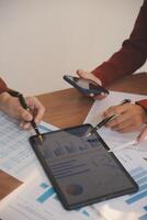 Business people are analyzing and planning business strategies. photo