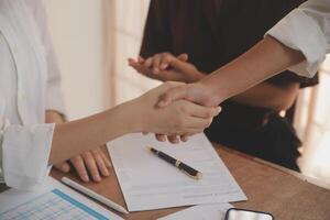 Leaders of business organizations join hands after the meeting is complete. Business partner meeting ideas. photo
