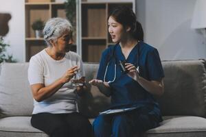 Doctor consulting with patient discussing something and Presenting results on report, Medicine and health care concept. photo