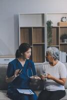 Doctor consulting with patient discussing something and Presenting results on report, Medicine and health care concept. photo