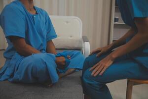 Professional physical therapist examines and cares for a young man in a physical therapy center, treating muscles and injuries of a man in a hospital. photo
