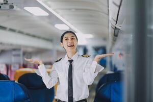 Portrait of a trained airplane captain in uniform preparing to fly, event planning in airplane. photo