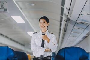 Portrait of a trained airplane captain in uniform preparing to fly, event planning in airplane. photo