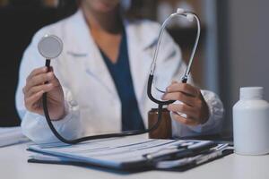 picture of doctor hand with stethoscope listening something photo