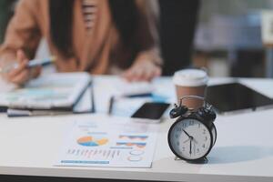 Business woman accountant working audit and calculating expense financial annual financial report balance sheet statement, doing finance making notes on paper checking document. photo