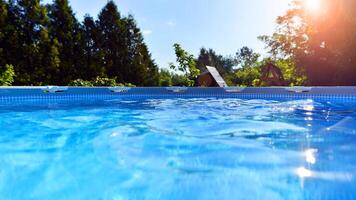 Natural garden with water pool. Garden on the background. Pool with clean water. photo