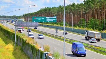 Warsaw, Poland. 24 July 2024. View of cars on the expressway S2, southern bypass of Warsaw in Wawer district. photo