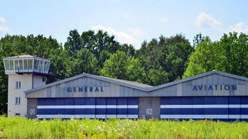 Goraszka, Poland. 15 July 2024. View of the former General Aviation Airport buildings and a grass runway. photo