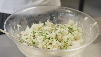 Chef Adds Chopped Parsley To A Fresh Fish Compound For Appetizer video