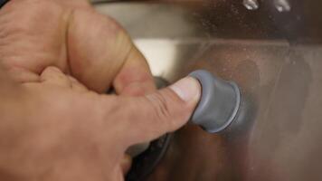 Chef's Hand Is Turning On The Gas Cooker Of A Restaurant video