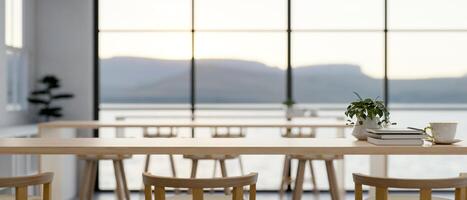 A space for displaying products on a wooden table in a modern minimalist co-working space. photo