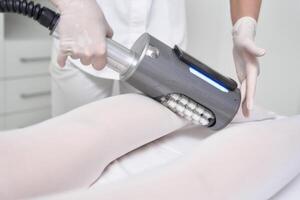 Professional Body Treatment Session Using Advanced Technology in a Modern Clinic Setting photo