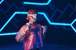 Young female gamer connect to virtual reality. photo