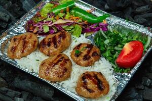 Grilled Meatballs With Rice and Salad photo