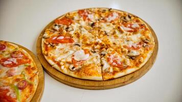 Pizza With Chicken and Mushrooms on Wooden Board photo