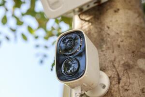Security IP CCTV camera using solar energy install on the tree for home security system photo