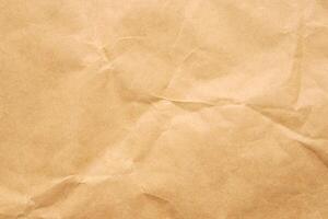 Abstract crumpled and creased recycle brown paper texture background photo