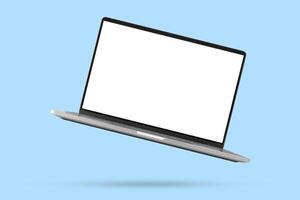 Laptop with blank screen isolated on blue background photo