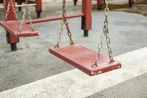Empty chain swing in the playground photo