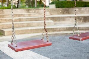 Empty chain swing in the playground photo