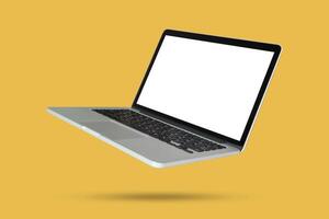 Laptop with blank screen isolated on yellow background photo