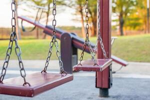 Empty chain swing in the playground photo
