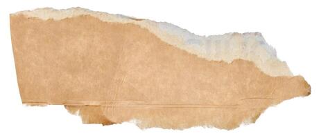 Torn piece of brown cardboard on a white isolated background, close up photo