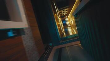 Abstract interior view with blue neon lighting and geometric shapes creating a futuristic corridor effect. video