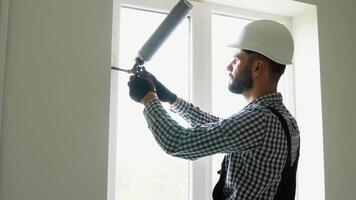 Installation of windows. Home repair. Use of foam when installing windows video