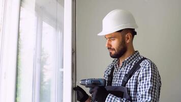 Industrial builder worker at window installation in new home video